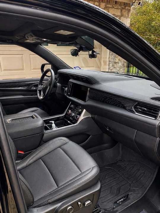 Black SUV interior fully detailed — leather, dash and mats spotless, Austin TX