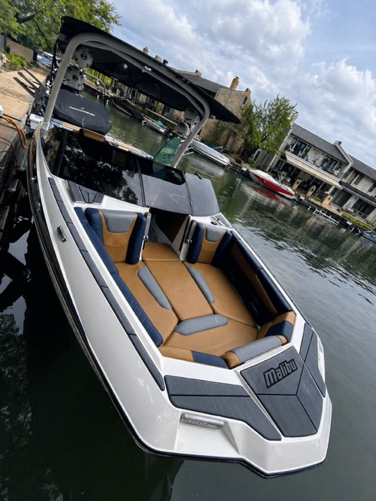 Malibu wake boat fully detailed at a Lake Austin dock